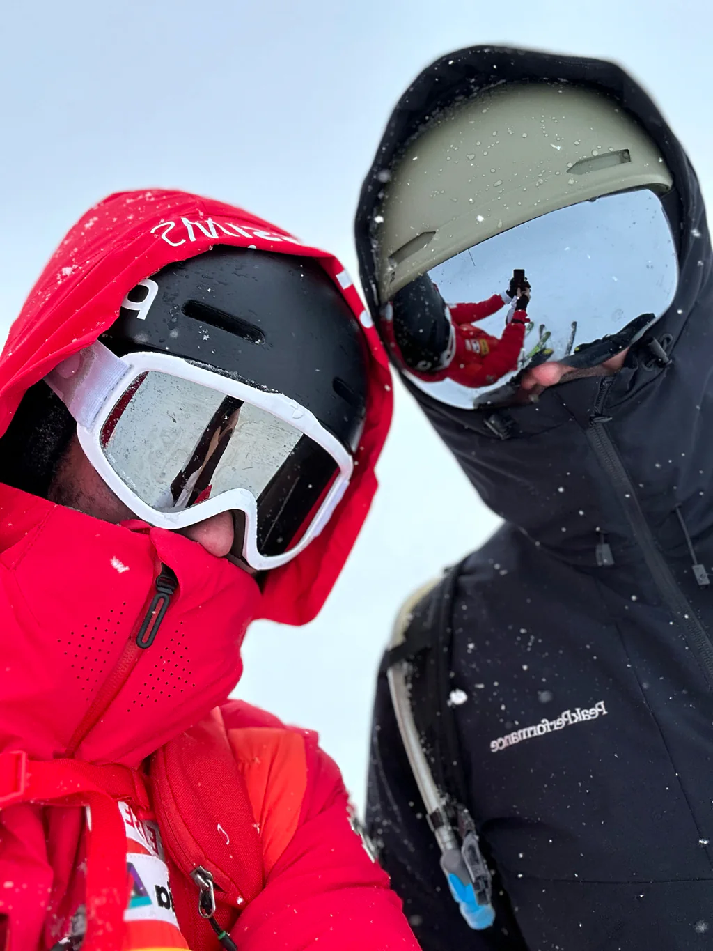 Two Peptone team members in ski goggles during a bright day on the slopes