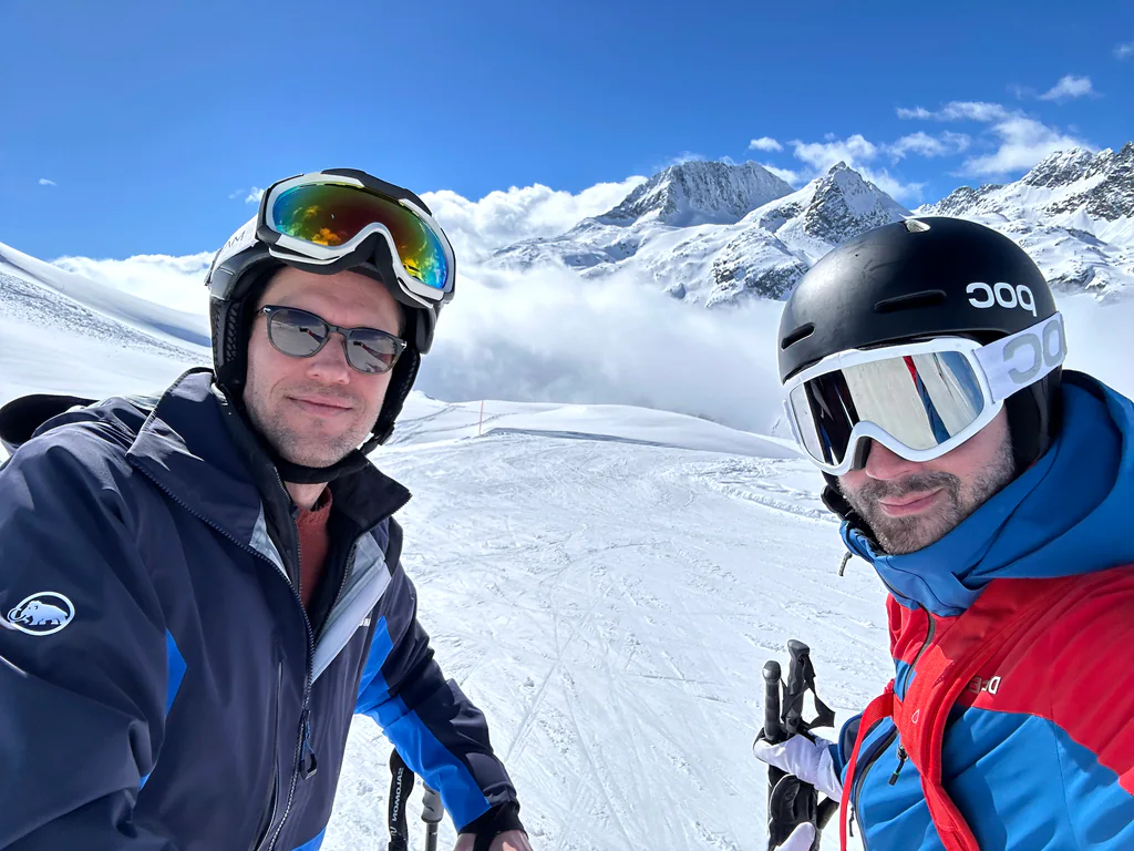 Two Peptone team members together on a high snowy ridge